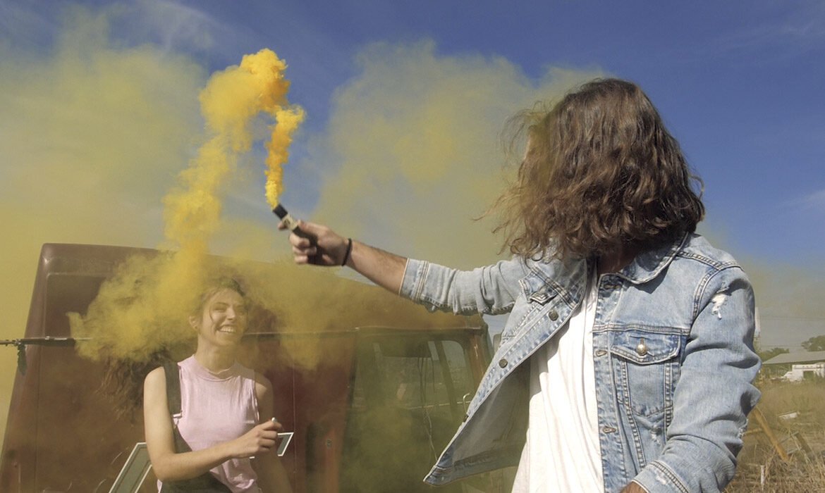 playing with a yellow smoke bomb